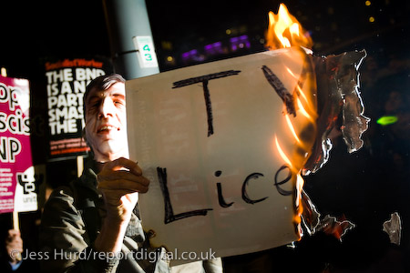Burning the TV Licence in protest. Unite Against Fascism demonstration opposing the invitation of BNP leader Nick Griffin on Question Time. BBC Television Centre, White City.
© Jess Hurd/reportdigital.co.uk
Tel: 01789-262151/07831-121483  
info@reportdigital.co.uk  
NUJ recommended terms & conditions apply. Moral rights asserted under Copyright Designs & Patents Act 1988. Credit is required. No part of this photo to be stored, reproduced, manipulated or transmitted by any means without permission.