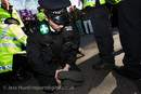 Police medic sits on a UAF protesters legs while arresting him on a demonstration against the English Defence League as they march in support of the Dutch Islamophobic politician Geert Wilders who was a guest of UKIP at the Houses of Parliament. London.

© Jess Hurd/reportdigital.co.uk
Tel: 01789-262151/07831-121483  
info@reportdigital.co.uk  
NUJ recommended terms & conditions apply. Moral rights asserted under Copyright Designs & Patents Act 1988. Credit is required. No part of this photo to be stored, reproduced, manipulated or transmitted by any means without permission.